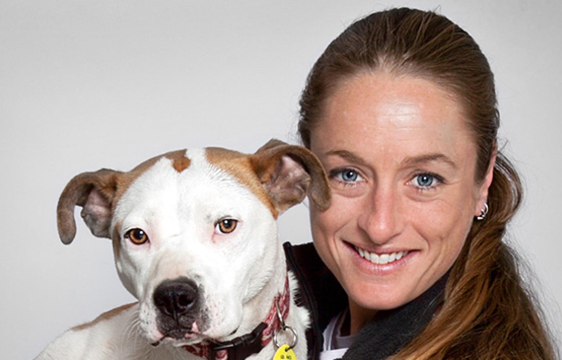 Michelle Logan, Director of National Shelter Embed Programming, with a pit bull terrier dog