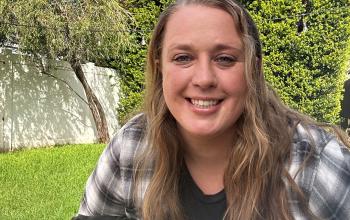 Tracy Hahn with a black dog