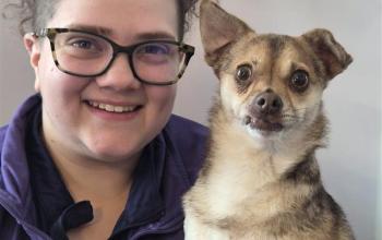 Karlie Repp with a small brown dog