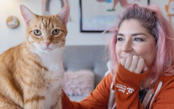 Samantha Bell with an orange cat