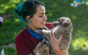 woman holding a puppy