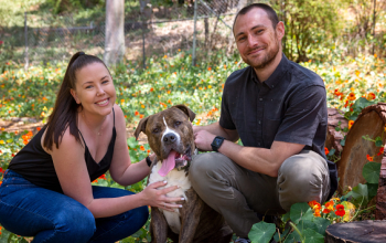 woman and man with a dog