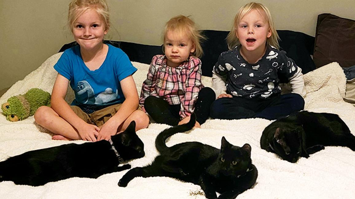 All three kids with all three kittens