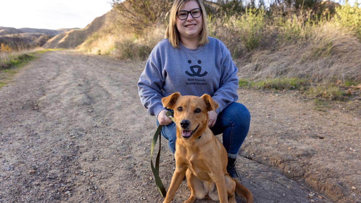 Person who is adopting Banana the dog, while outside on a walk together