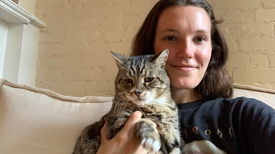 Madison holding Mayflower the tabby cat