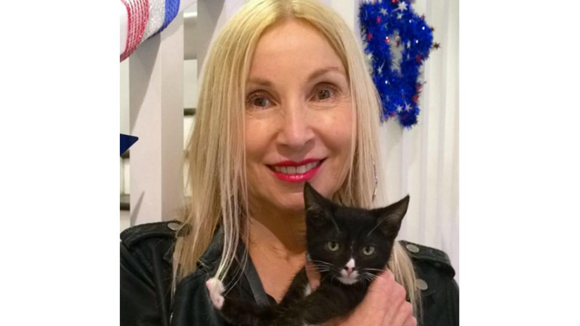 NKLA Pet Adoption Center volunteer Ruth with a cat