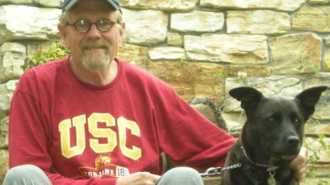 Volunteer Bill with his black dog