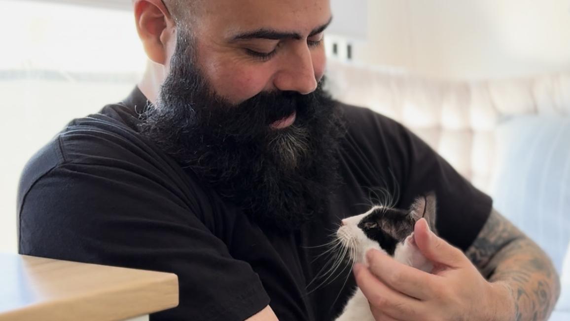 Chris with Orpha the cat