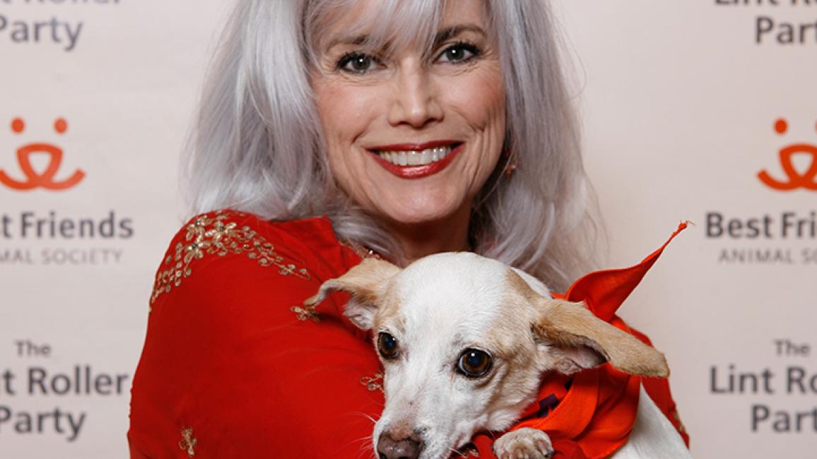 Emmylou Harris and white dog at Best Friends Lint Roller Party