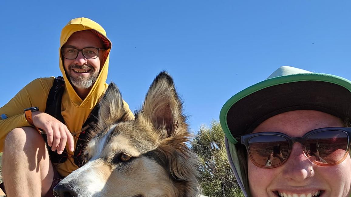 Kieran Corrigan with another person and a dog