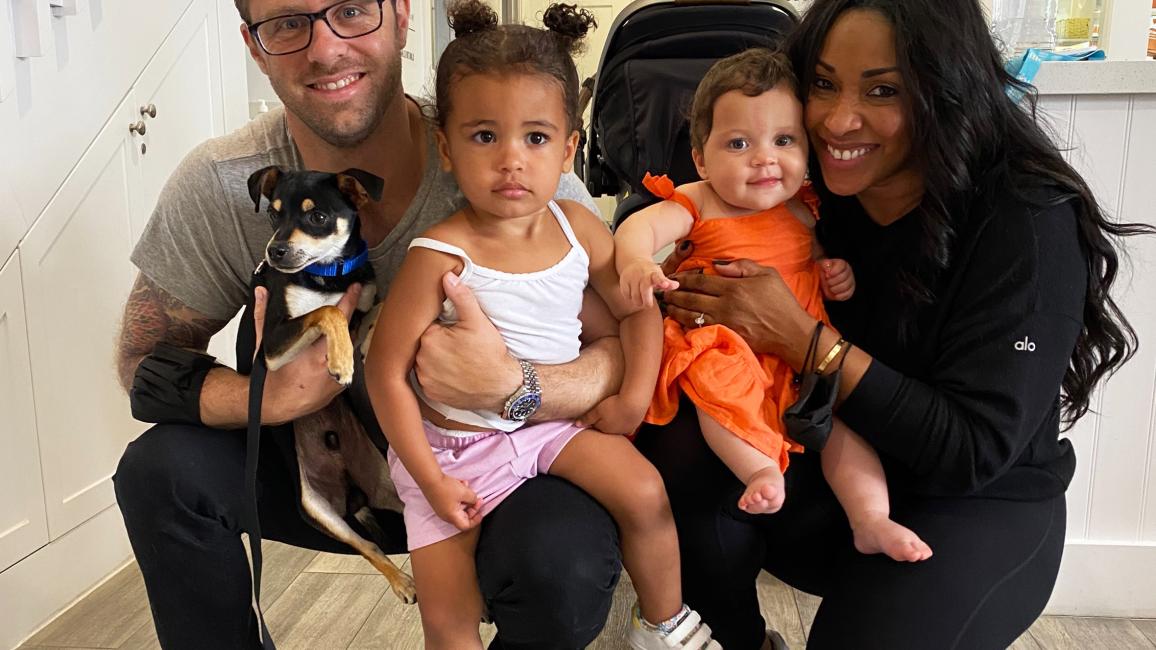 Family adopting a puppy at the National Adoption Weekend