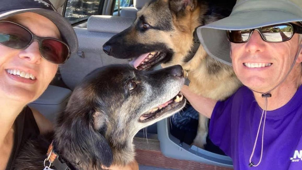 An older Emma the dog with her family in a vehicle