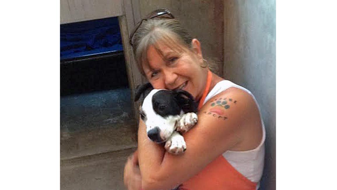 Volunteer Patty Parks with a dog