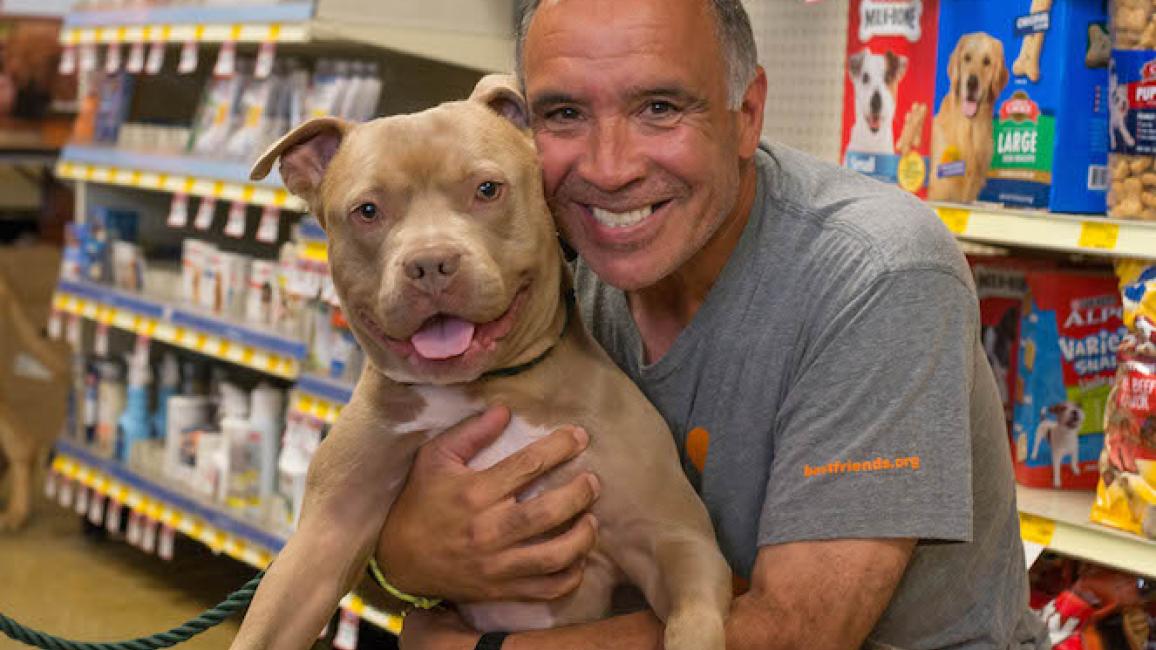 Volunteer Peter Vega with alum, Porkchop