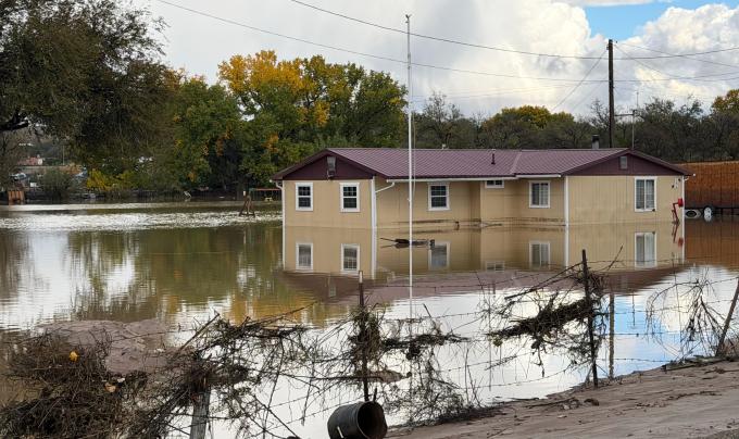 Flooding around a house in Shiprock, New Mexico