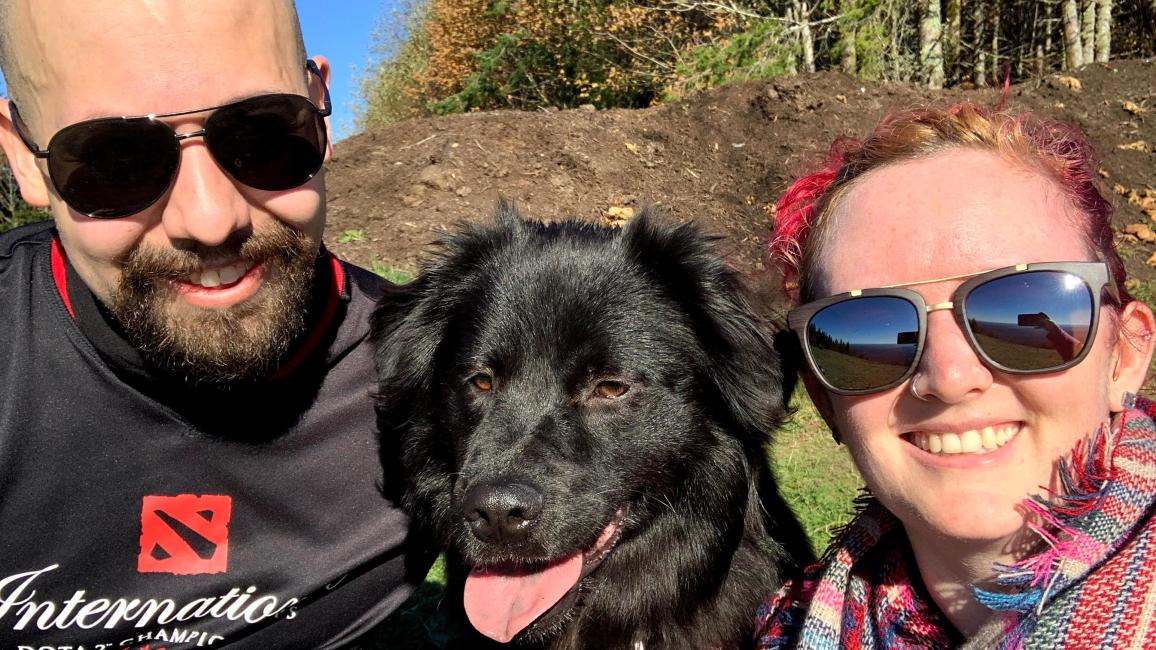 Kaley and Joe Mans with Olympia the dog between them