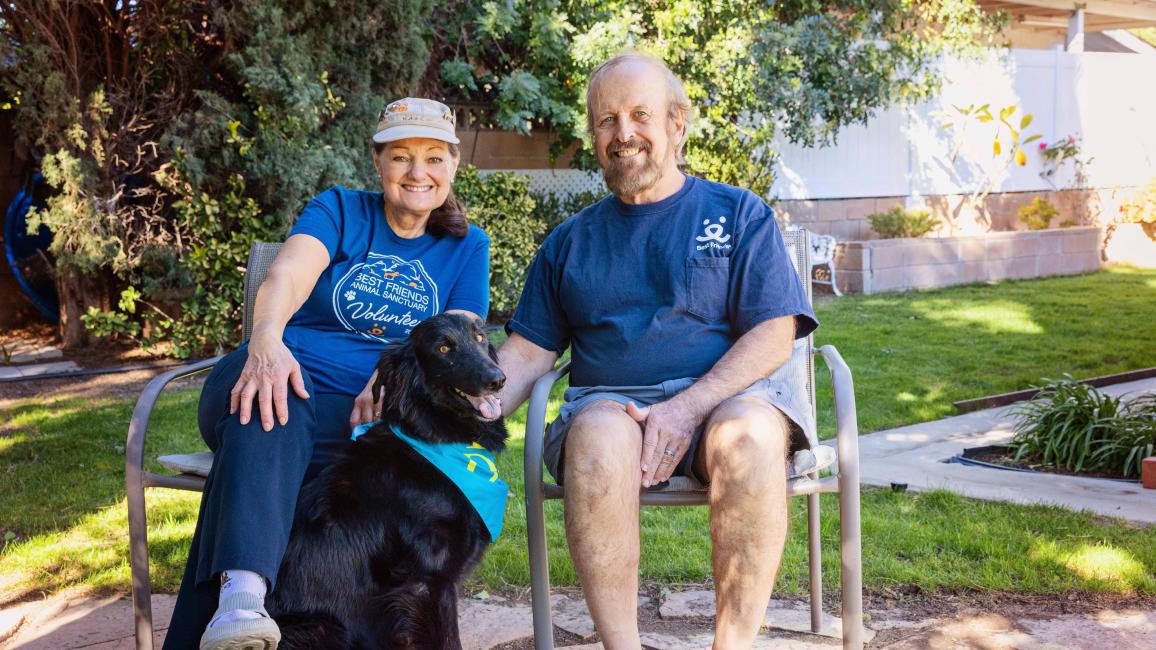 Karla and Scott Hanley sitting next to Salem the dog