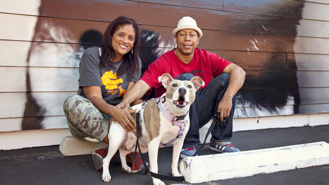 Couple with dog they adopted from the NKLA Pet Adoption Center