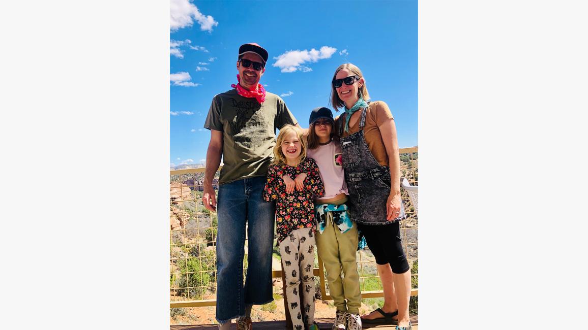 The Williams family outside in Angels Canyon in front of a blue sky