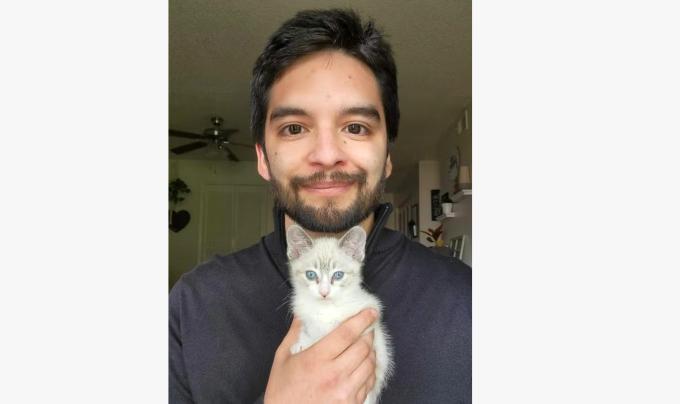 Justin Serna holding a kitten