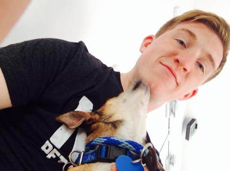 Volunteer Clinton Downs with his dog