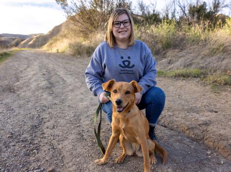 Person who is adopting Banana the dog, while outside on a walk together