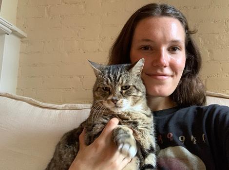 Madison holding Mayflower the tabby cat