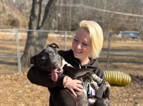 An incarcerated woman lovingly fosters a dog