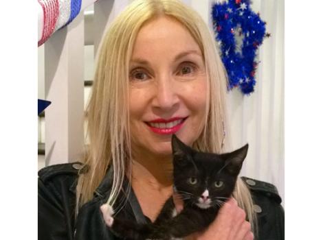 NKLA Pet Adoption Center volunteer Ruth with a cat