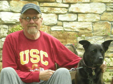 Volunteer Bill with his black dog