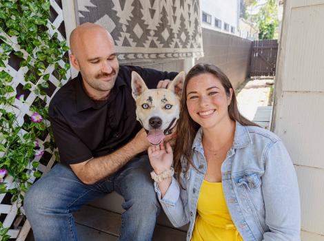 Bonny the dog with adopters Bevin and Cam