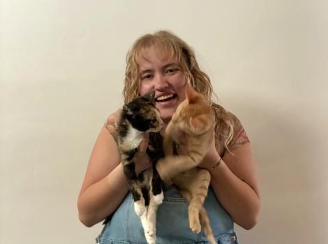 Jenna Sume holding Bug and another cat