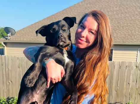 Heather holding Goose the dog
