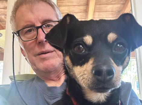 Eleanor the dog with Mark behind her