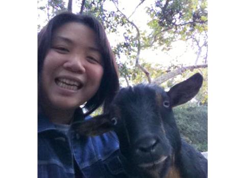 Volunteer Jenny with a goat