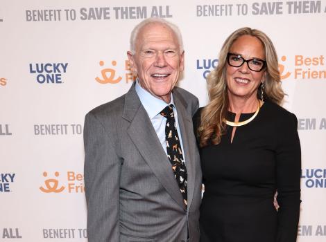 Rich Avanzino and Julie Castle in front of a Best Friends Benefit to Save Them All backdrop