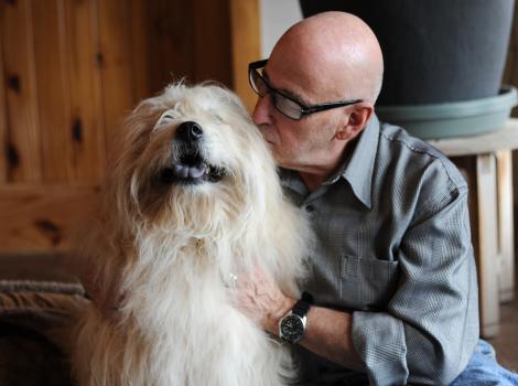 Best Friends co-founder Francis Battista kissing Teddy the dog