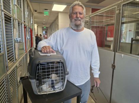 Mike picking Buster up after FIP treatment