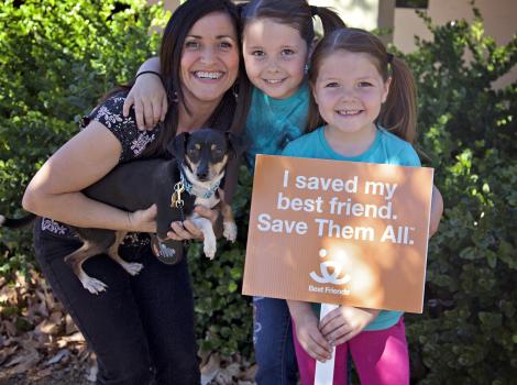 Family with their adopted dog
