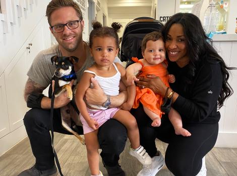 Family adopting a puppy at the National Adoption Weekend
