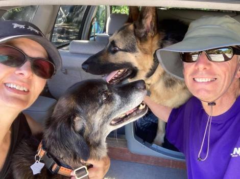 An older Emma the dog with her family in a vehicle