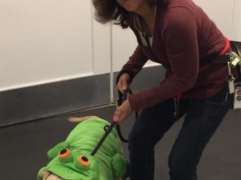 Volunteer Lori Winslow with her dog dressed up for Halloween