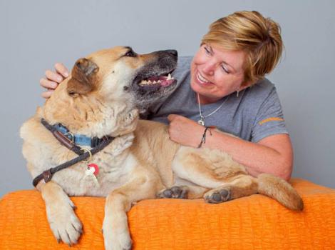 Volunteer photographer Pam with a dog