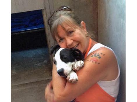 Volunteer Patty Parks with a dog