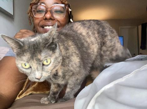 Breonna with Pumba the cat in her lap