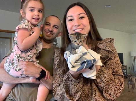 Baby Scout the kitten with her new family