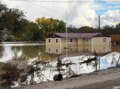 Flooding around a house in Shiprock, New Mexico