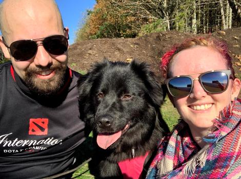 Kaley and Joe Mans with Olympia the dog between them