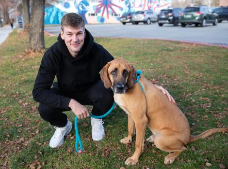 Kyle Filipowski with Topino the dog