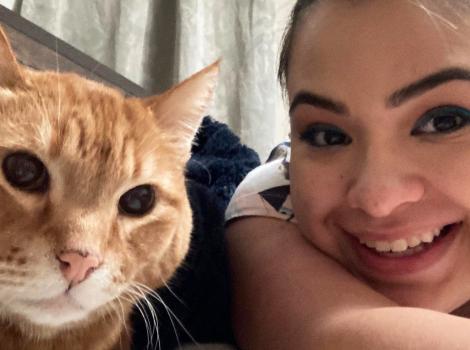 Selfie of Elton the orange tabby cat and Aubrey Tsosie